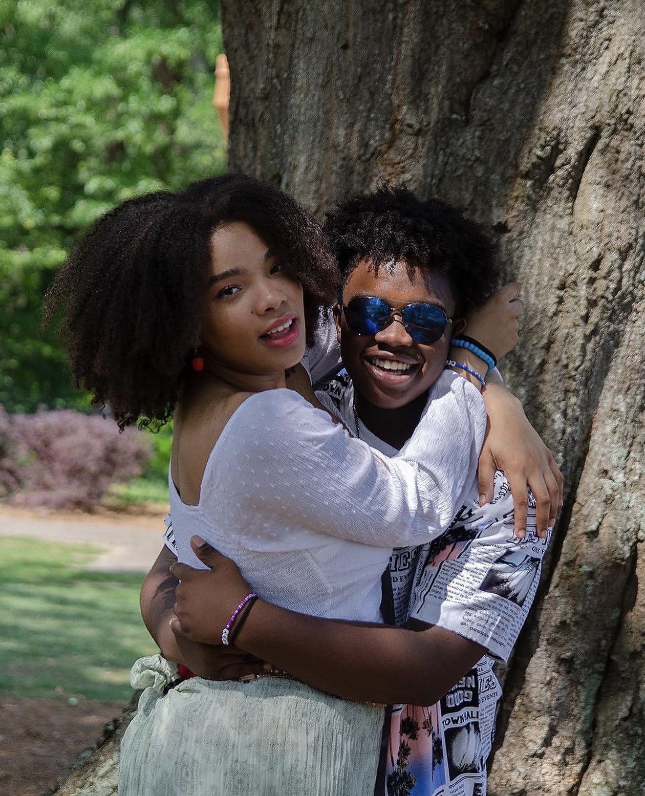 Couple embracing under a tree