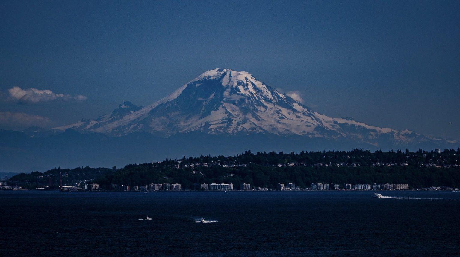 Blue hour mountain over water